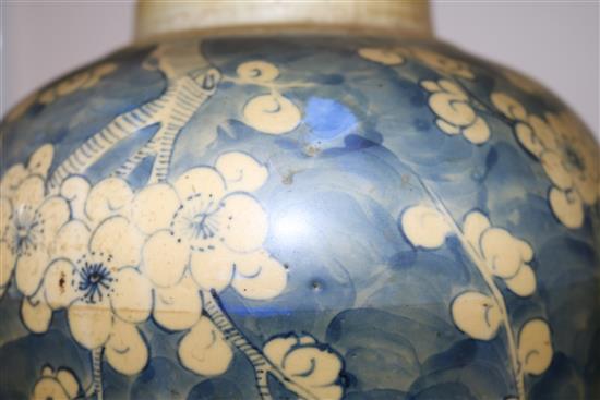 Two Chinese blue and white ovoid jars, 19th century, largest 23cm, carved wood stands and cover